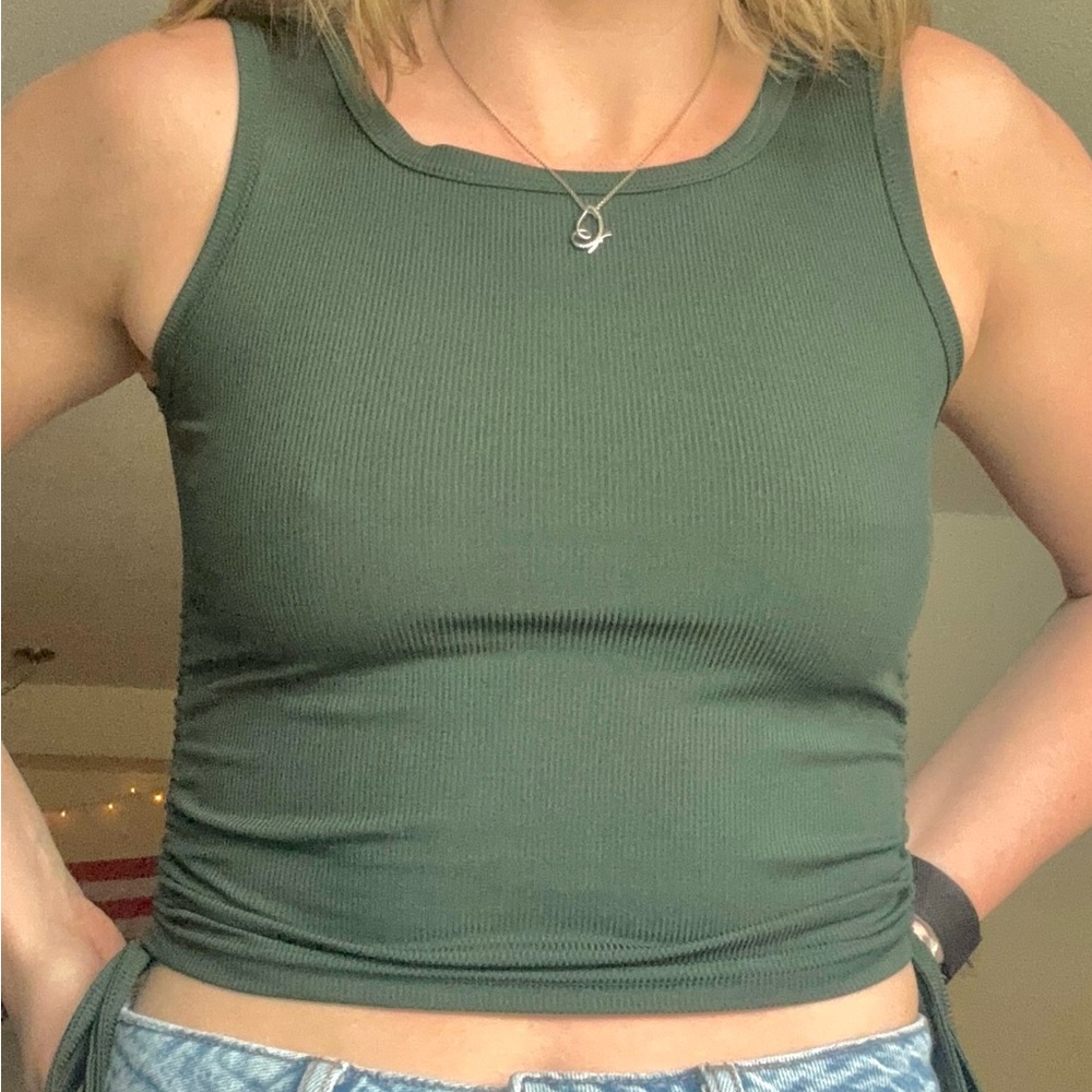 green tank, cinching ties at the side